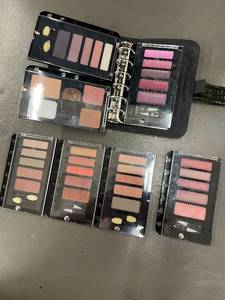 lot 97 image: Binder of 7 Refillable Makeup Palettes with Leather Case