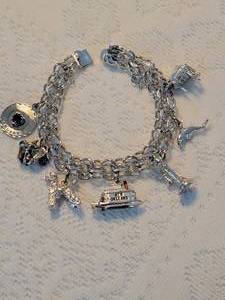 lot 105 image: Sterling Silver Charm Bracelet  59g