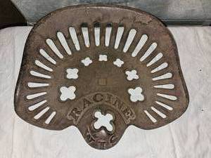 lot 54 image: Vintage Cast Iron Tactor Seat Racine, Wisconsin markings