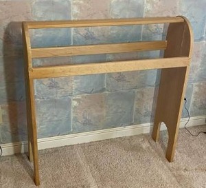 lot 91 image: Adorable Blonde Scandanavian Quilt Rack with Traditional Carved Accents