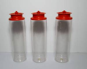 lot 178 image: Vintage Tupperware Acrylic Canisters  Set of Three with RedOrange Lids