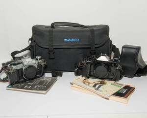 Vintage Canon A-1 and Canon AE-1 Film SLR Cameras with Bag