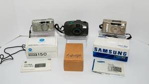 lot 421 image: Three Vintage Point and Shoot 35mm Compact Film Cameras