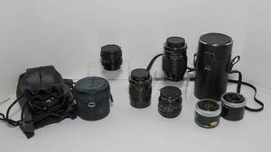 lot 21A image: Four Vintage Canon Camera Lenses and Two Extenders