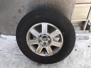 lot 60 image: Chevy 6 Lug Wheel and Tire - 27565R18