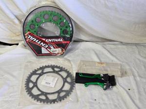 lot 38 image: Renthal Dirt Bike Sprocket, Another Dirt Bike Sproket, Supersprox 520 Chain and Brake Levers Set