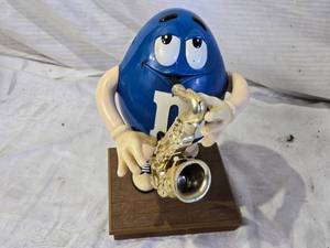lot 65 image: Blue M&Ms Character Playing Saxophone Figurine