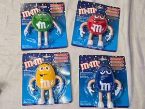 lot 68 image: 4 M&Ms Candy-Themed Figurine Containers In Package