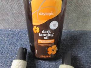 lot 78 image: 7- 8 oz Daylogic Dark Tanning Oil...
