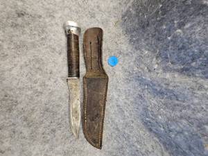 lot 150 image: Leather Handled Hunting Knife with Sheath, appears to be Western Brand