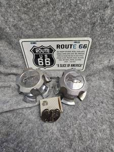 lot 155 image: Route 66 Plate, 2-Mid 70s Chevy Rally Center Caps, Eagle Belt Buckle