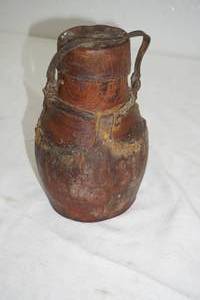 lot 334 image: Tribal Drink Vessel. Leather & Wood