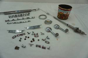 lot 435 image: Vintage Chevy emblems & window handles