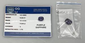 lot 44 image: GIE 12.90 Ct. (LAB CREATED) Cushion Cut Purple Sapphire With Card