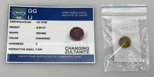lot 56 image: GGIJ  8.90 Ct. (LAB CREATED) Round Cut Changing Zultanite With Card