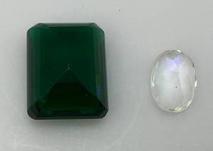 lot 59 image: Misc. (Lab Created) Gems Including Oval Cut Multi-Colored Gem & Large Emerald Cut Green Gem Stone 78 L x 1 18 H x 12 W