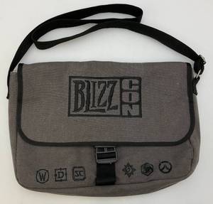 lot 88 image: Blizzard BLIZZCON 2015 Messanger Bag, Laptop Bag, WOW,Diablo, Starcraft & Overwatch (Large Stain Under Flap)