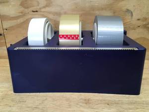 lot 73 image: Heavy Duty Tape Organizer with 3 Rolls of Tape