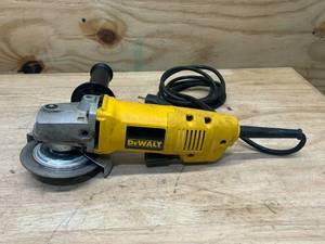 lot 109 image: DEWALT DW402 4-12 Corded Angle Grinder