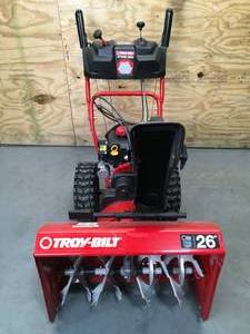 lot 1A image: Troy-Bilt Storm 26 208 cc Two- Stage Gas Snow Blower with Electric Start Self Propelled Model # 31AS6KM3B23