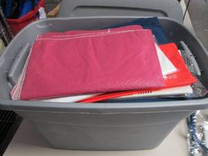 lot 348 image: Covered tote full of tablecloths
