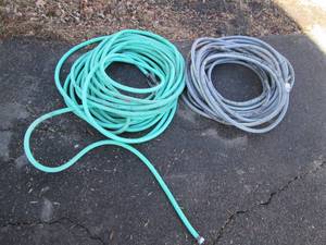 lot 53 image: Pair of heavy duty garden hoses...