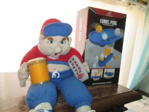 lot 142 image: Funnel Pong Game and a stuffed vers...
