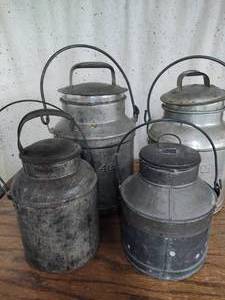 Four Vintage Milk Cans