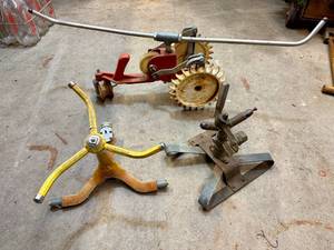 Vintage Lawn Sprinklers including Thompson Traveling Tractor Walking Lawn Sprinkler