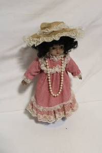 lot 24 image: Vintage Porcelain Doll in Pink Dress with Pearl Necklace
