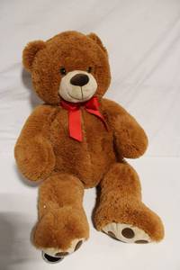 lot 77 image: Large Plush Teddy Bear with Red Bow
