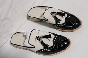 lot 274 image: Stuart Weitzman M8.5 Tassel Loafers with Black and White Design