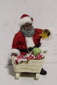 lot 147 image: Santa Claus Figurine with Baby in Cradle Decoration