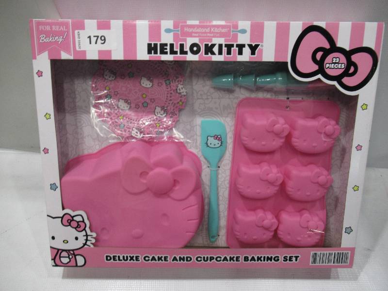 lot 401 image: NEW Hello Kitty Deluxe Cake and Cupcake Baking Set Silicone Molds (23 pieces)