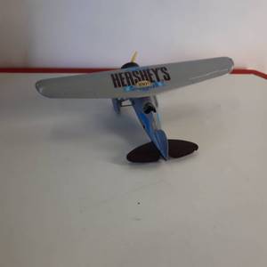 lot 19 image: Die Cast Metal Airplane Coin Bank. 100th Anniversary - Hersheys Brand 1929 Lockheed Air Express