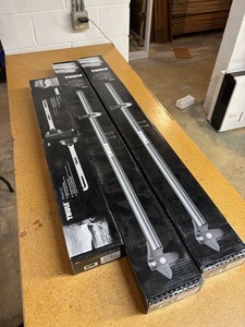 lot 40 image: (2) Thule Prologue Roof Racks and Wheel Holders