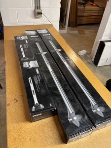 lot 41 image: (2) Thule Prologue Roof Racks and Wheel Holders - NEW
