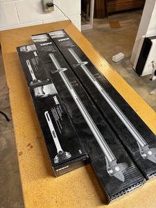 lot 42 image: (2) Thule Prologue Roof Racks and Wheel Holders - NEW