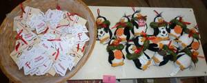 Group of Plush penguins and a basket of angel ornaments