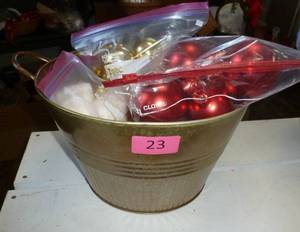 Metal bucket full of christmas bulbs