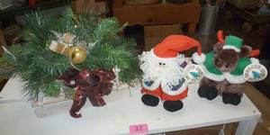Custom sleigh table centerpiece and a plush santa and his reindeer