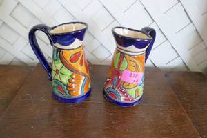 2 terracotta glazed painted pitchers