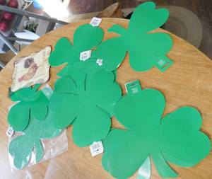 About 30 shamrocks and a tin rooster