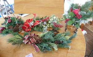 Holiday greenery baskets and wall hangings