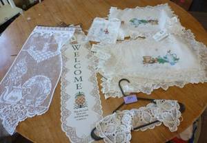Lace wall hangings, placemats, table runners and a collar