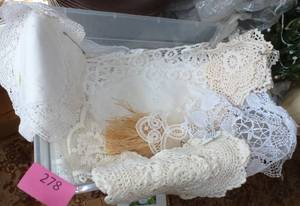 container full of Lace doilies
