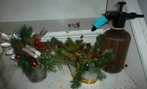 2 arrangements in metal containers plus a large 2 qt water mister