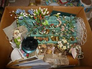 box with miniatures including a tiered display stand for them