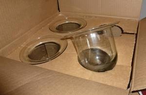 3 larger candle holders and a large basket of fake fruit