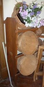wood display that holds 3 baskets for silk flowers